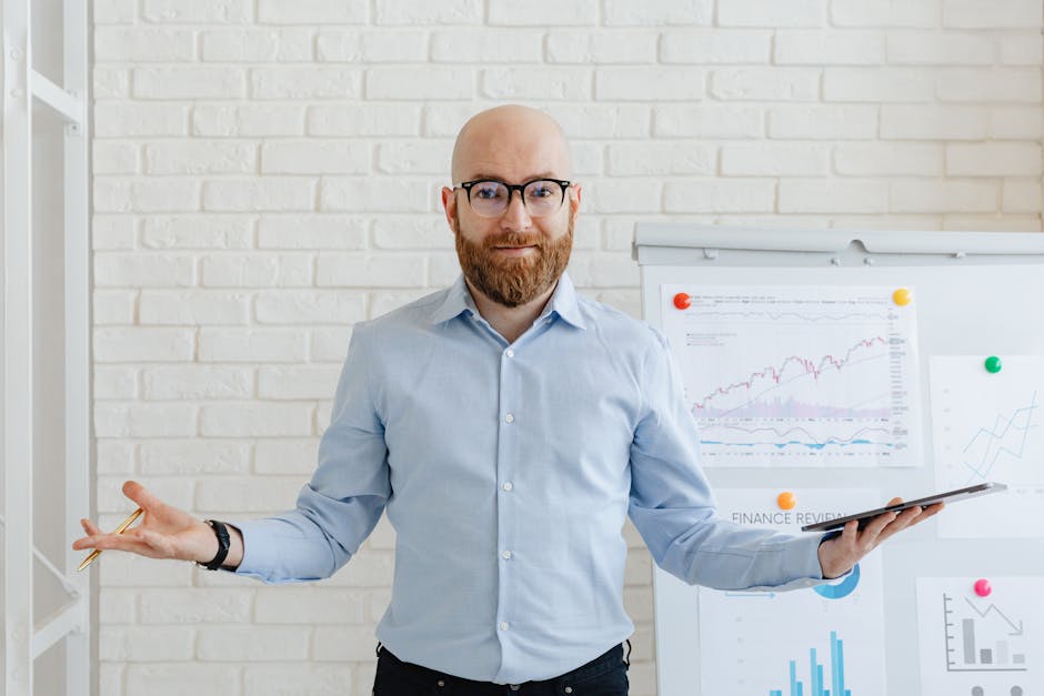 A businessman in an office with charts presenting financial analysis confidently.
